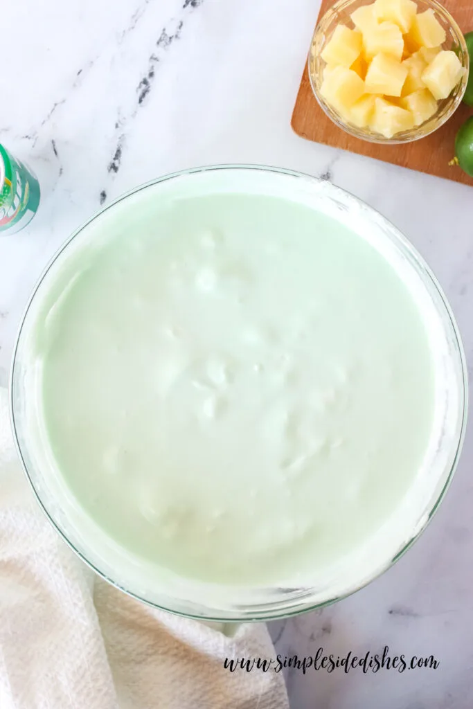 Pineapple mixed into Jello. It is now ready to pour into a serving dish.