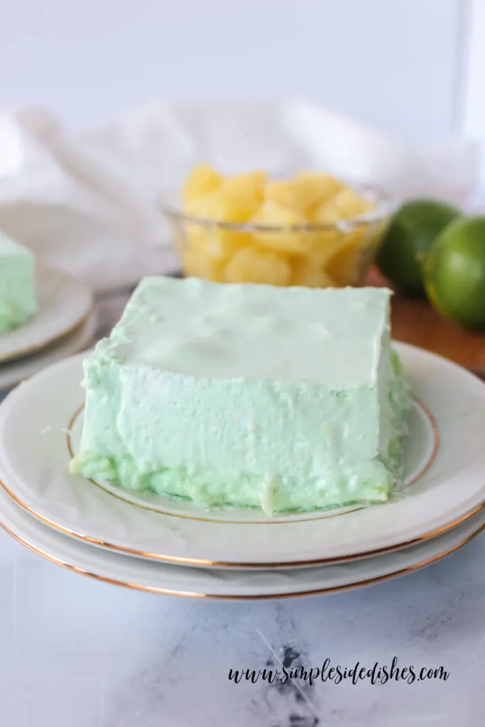 Side view of a slice of Jello on a plate, ready to serve.