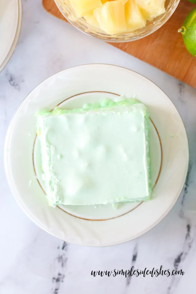 Top view of a slice of Jello on a plate.