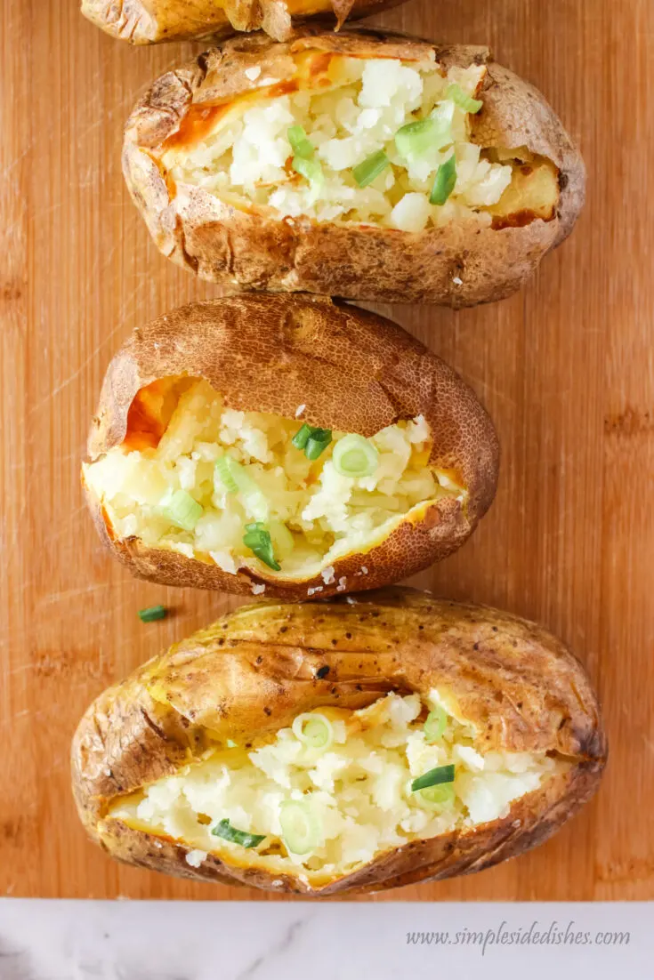 close up zoomed in image of baked potatoes ready to serve.