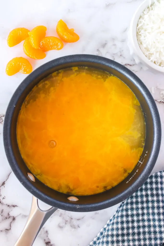 sugar, salt, egg yolks and pineapple juice in a pot.