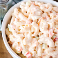 Top side angle of prepared pasta salad in a serving bowl.