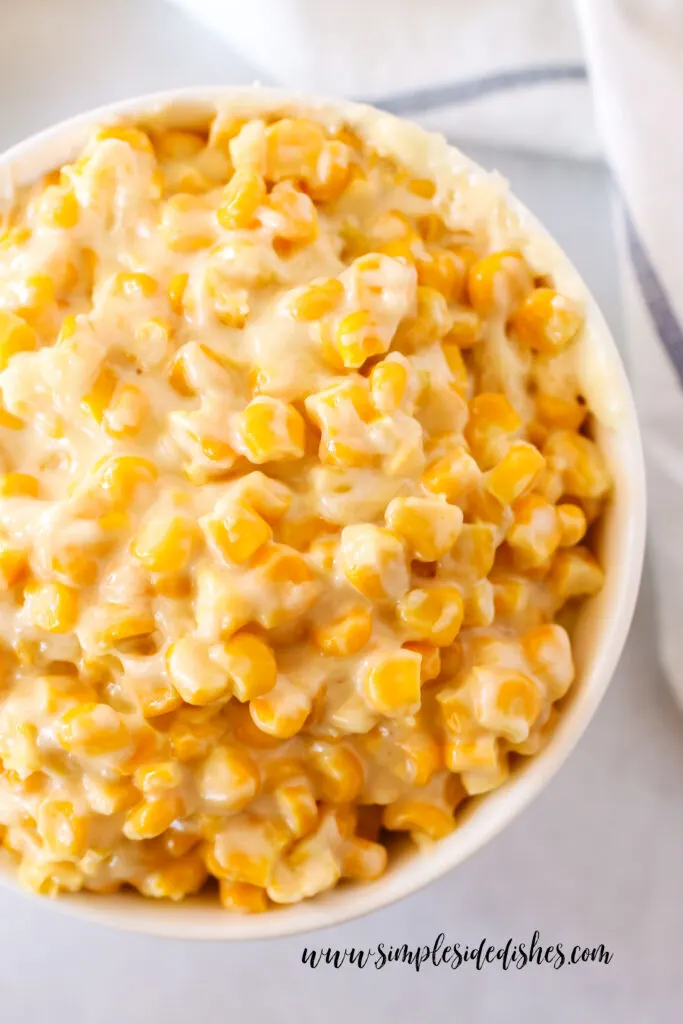 zoomed in image of cream corn in a serving bowl.