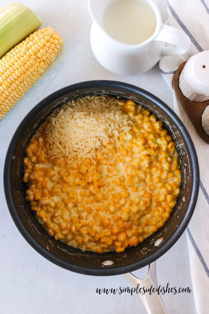 Parmesan cheese has been added to cream corn.