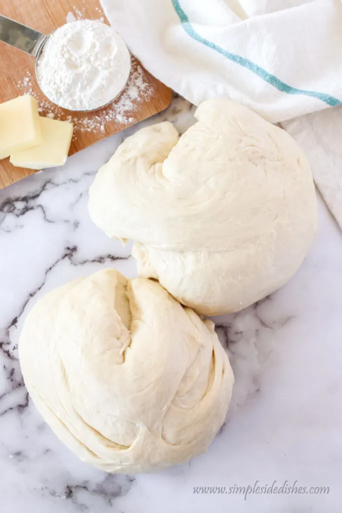 dough cut in half to make two loaves.