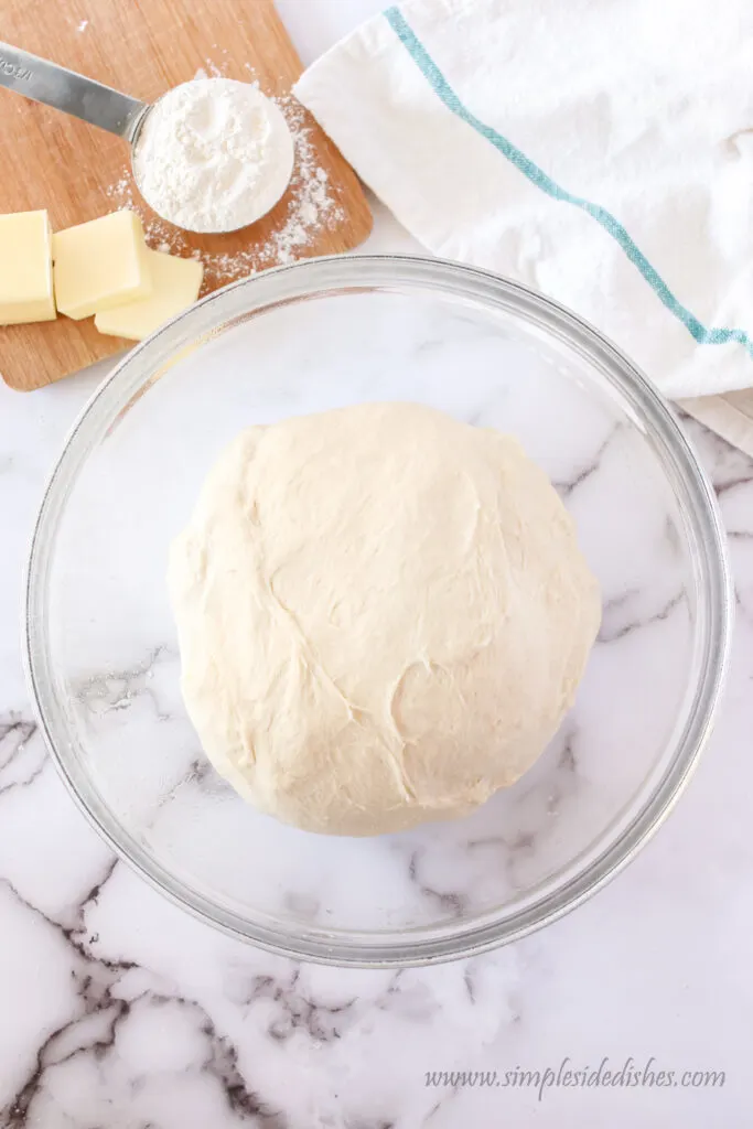 bread dough transferred to a bowl ready to rise