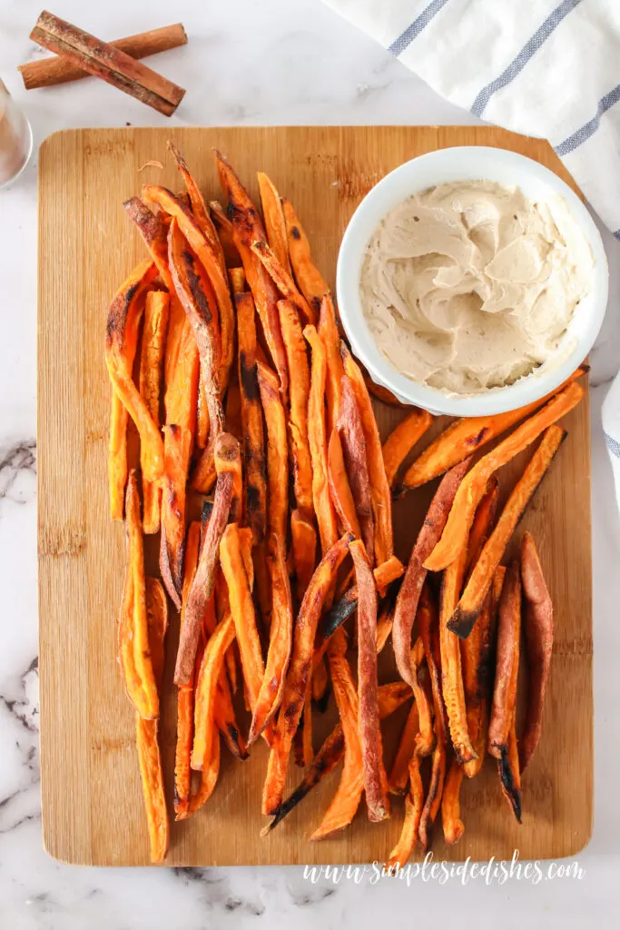 sweet potato fries on serving board with cinnamon butter