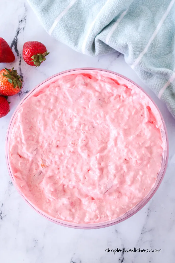 strawberries and cool whip mixed into cottage cheese mixture to create fluff