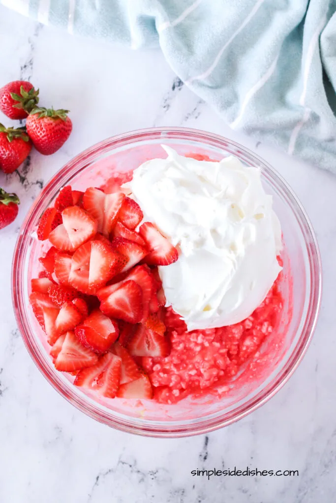 fresh cut strawberries and cool whip added to cottage cheese mixture, umixed.