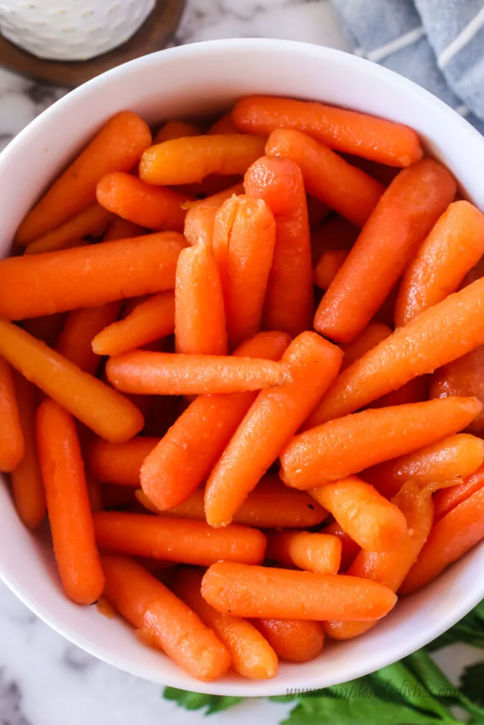zoomed in image of cooked carrots in bowl