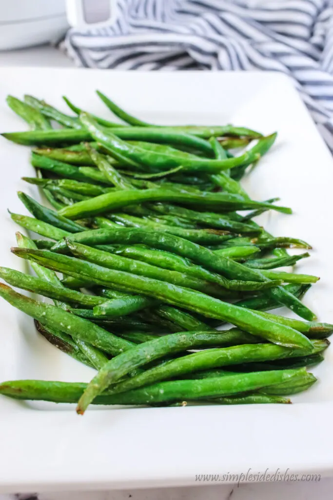side view of green beans on a platter.