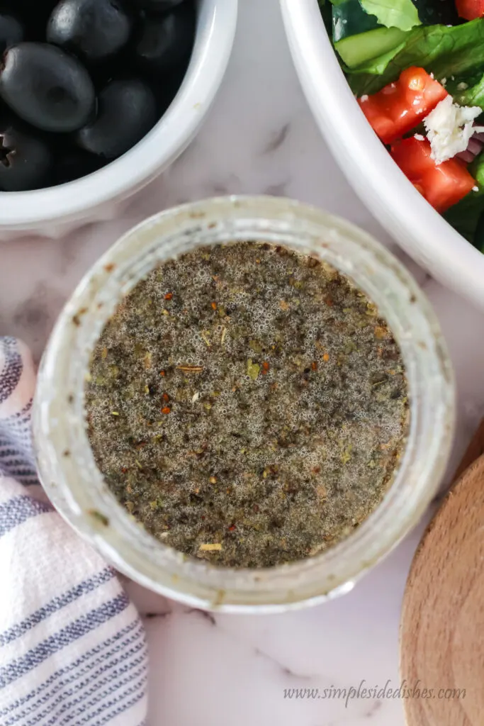 salad dressing ingredients in a jar all mixed up.