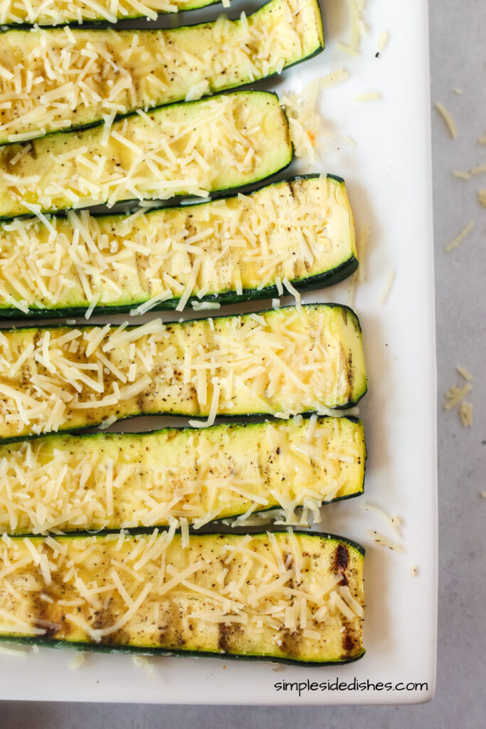 zoomed in image of zucchini on a platter, zucchini facing side ways.