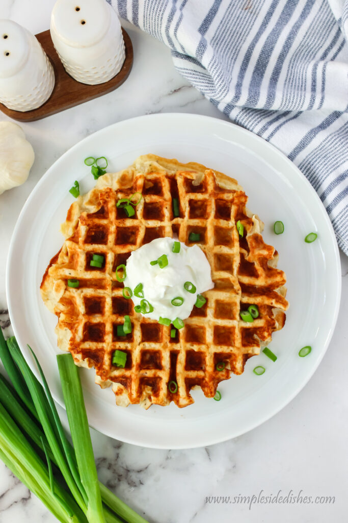 zoomed out image of potato waffles on a plate