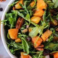 zoomed in image of squash salad in a bowl.