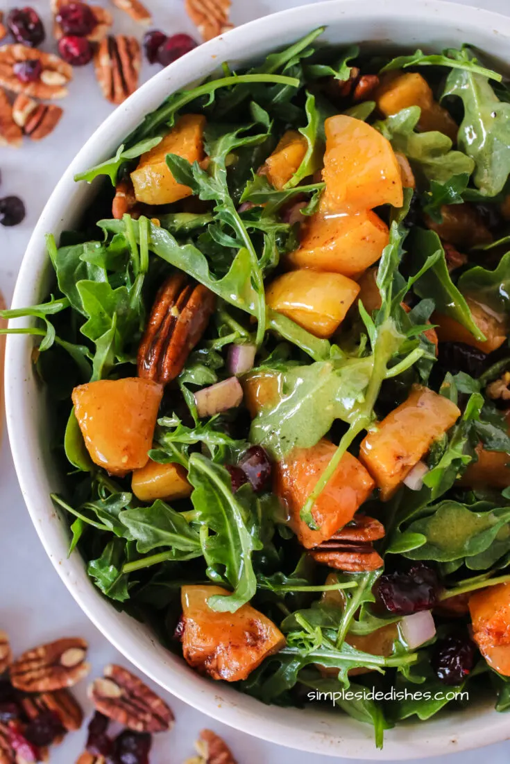 zoomed in image of squash salad in a bowl.