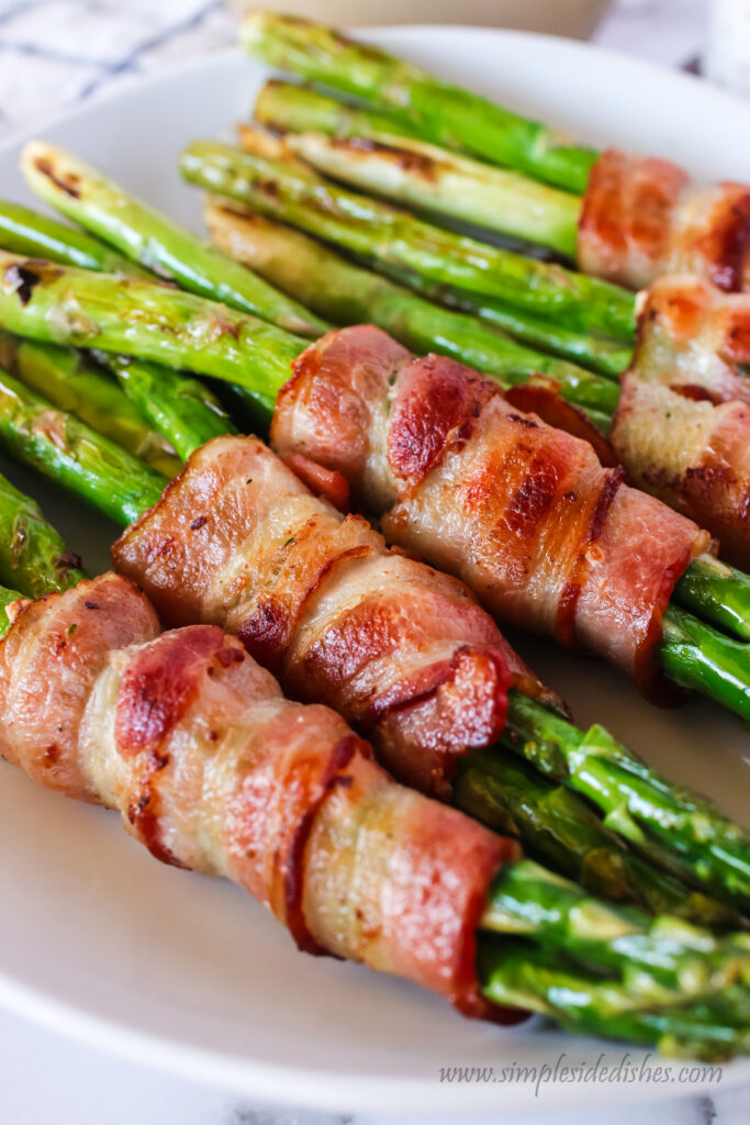 close up of bacon around the asparagus to show how crispy it is.