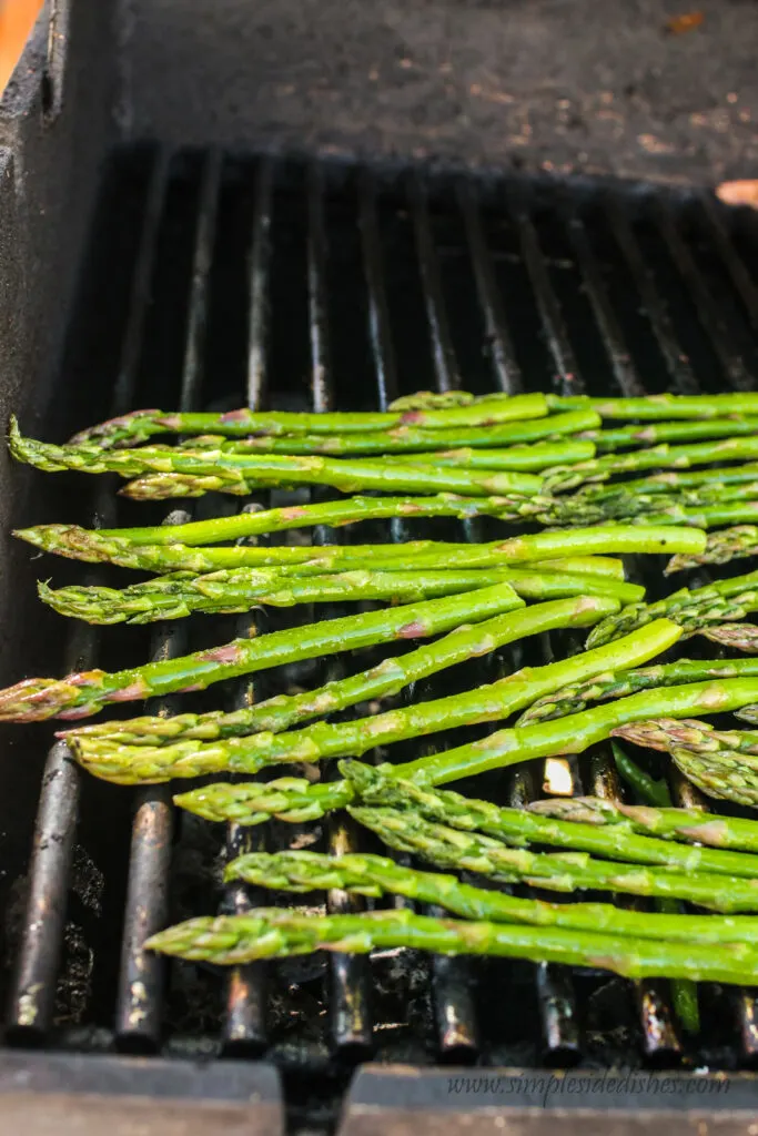 zoomed out image of asparagus on the grill