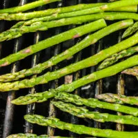 close up of asparagus on the grill