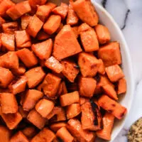 zoomed in view of sweet potatoes in a serving bowl