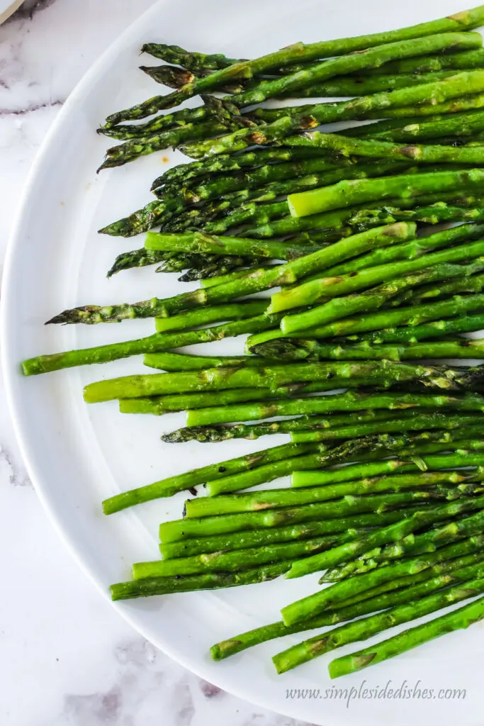 close up of fresh grilled asparagus on a plate