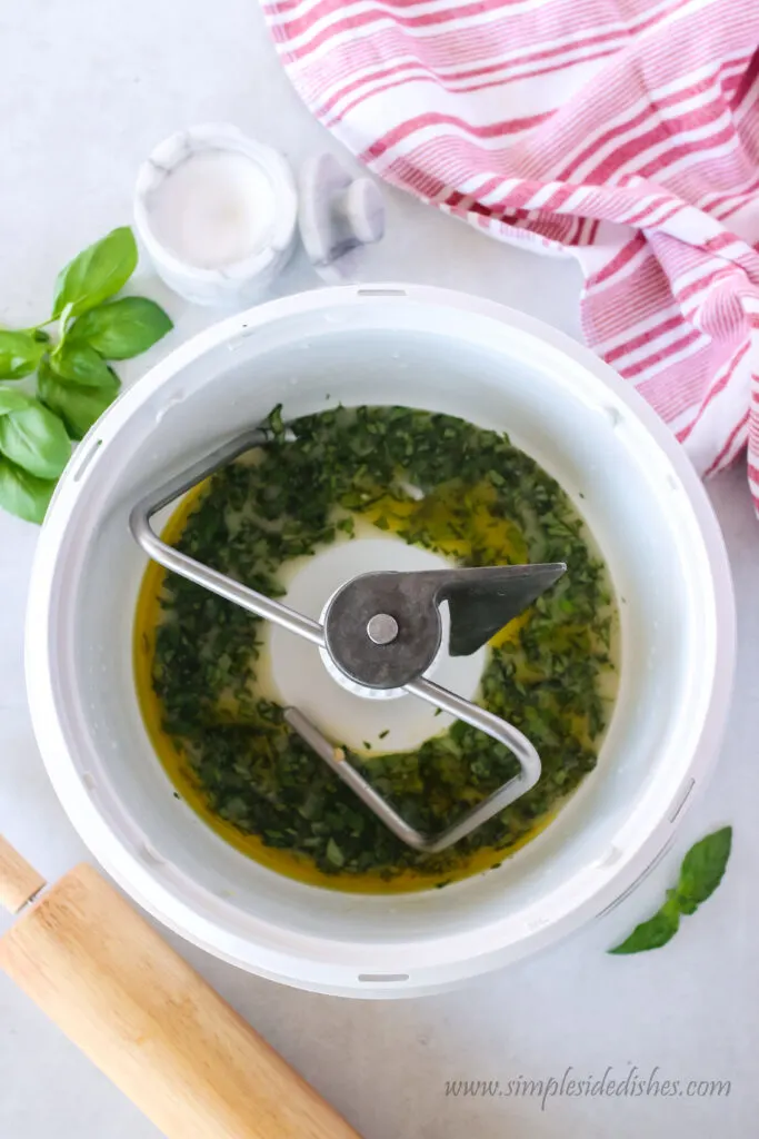 oil, basil and and salt added to mixing bowl