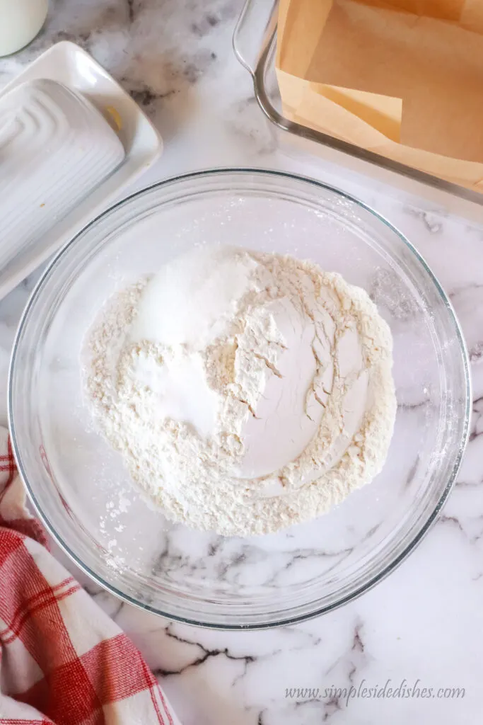 flour, baking powder, sugar and salt in a bowl