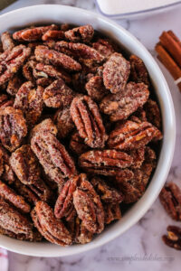 zoomed in close up of pecans in a bowl