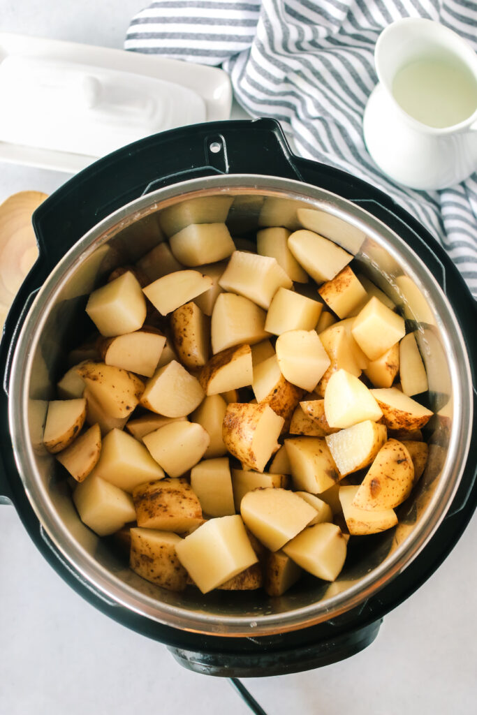 raw cut potatoes added to chicken broth in instant pot