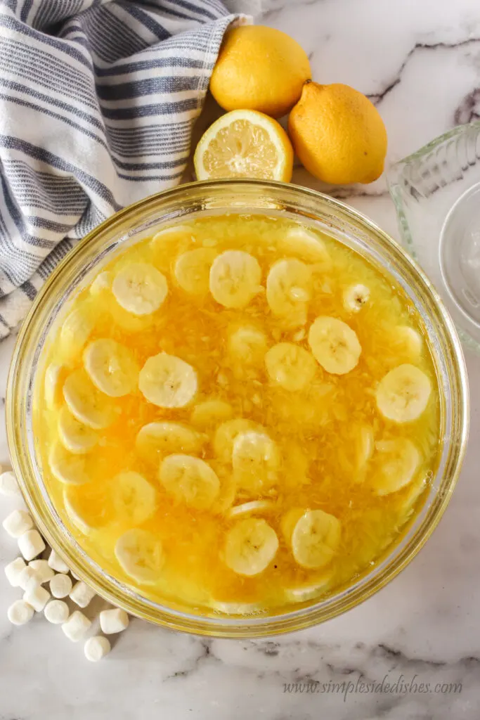 sliced bananas added to jello