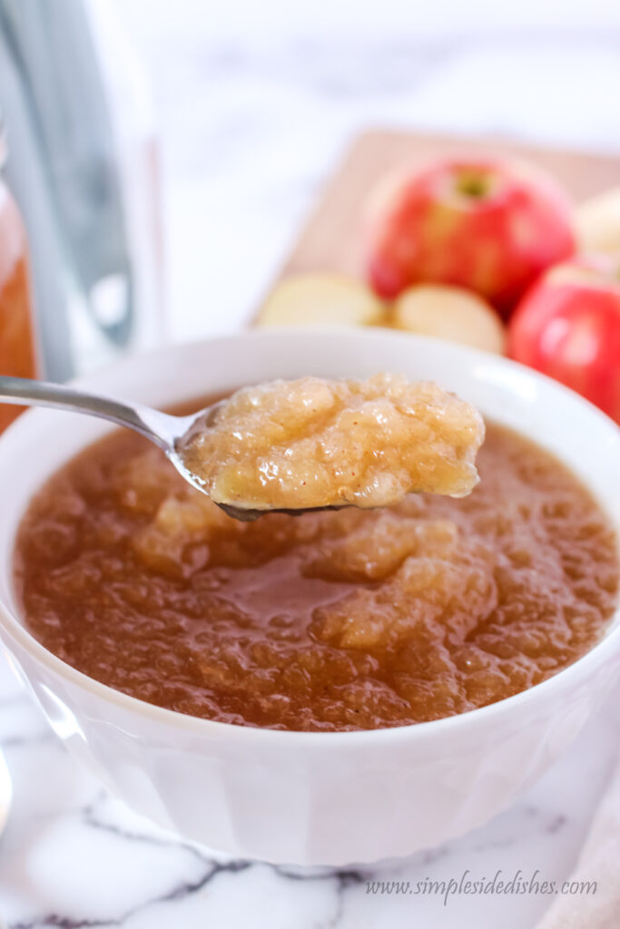 applesauce in a bowl with a spoonful