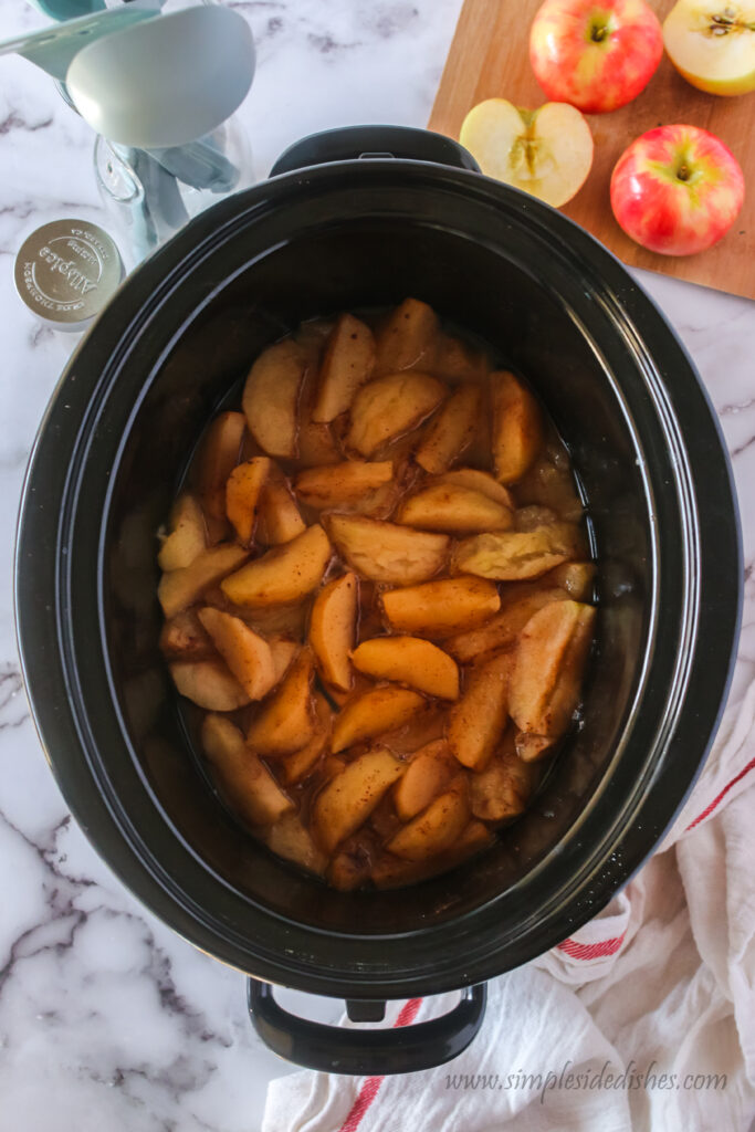 cooked apples in crockpot ready to mash. Photo taken from the top looking down