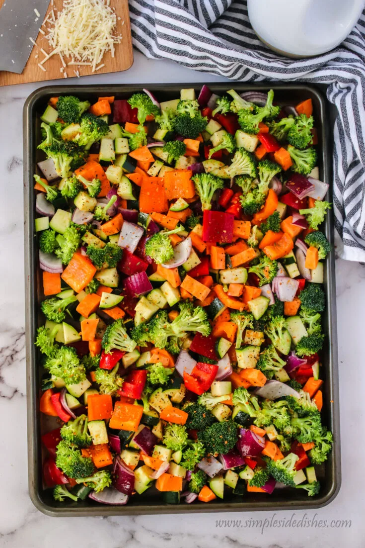 vegetables on cookie sheet cut up and coated in vegetable oil