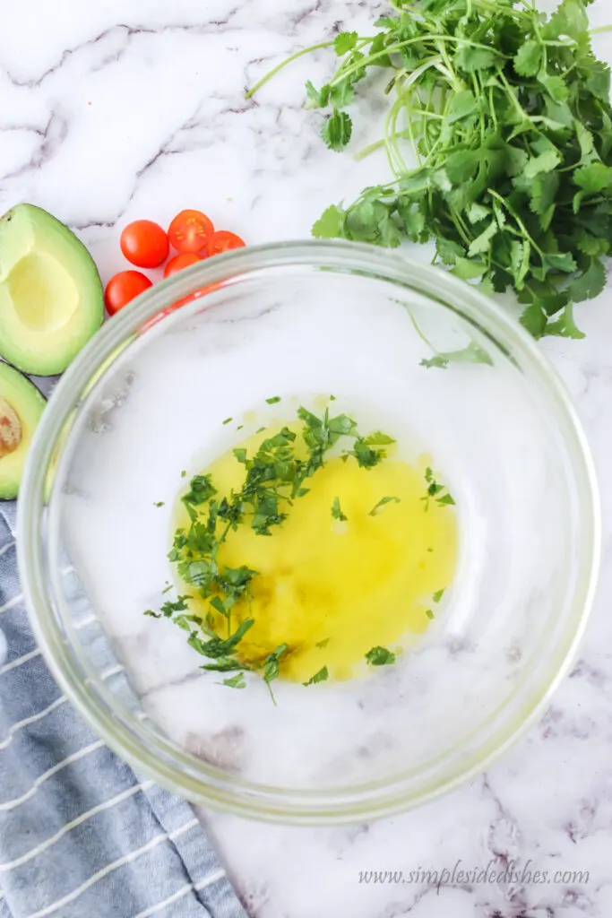 olive oil, lime juice, cilantro and salt all added together in a bowl