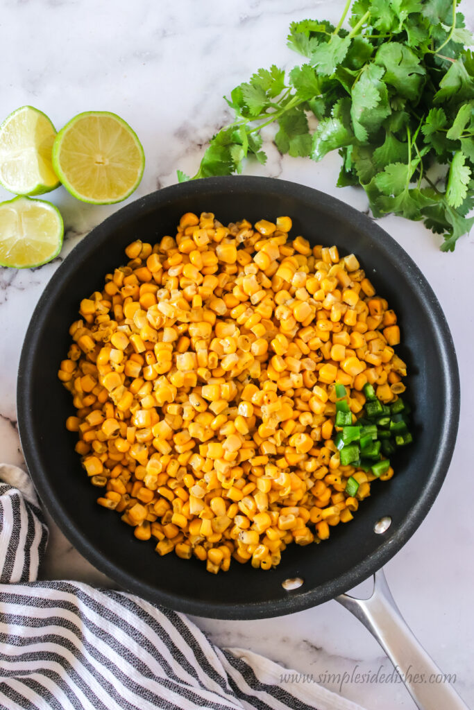 fire roasted corn and jalapenos in a skillet