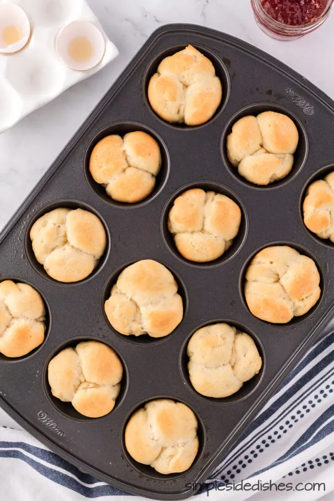 Baked cloverleaf icebox rolls in muffin pan.