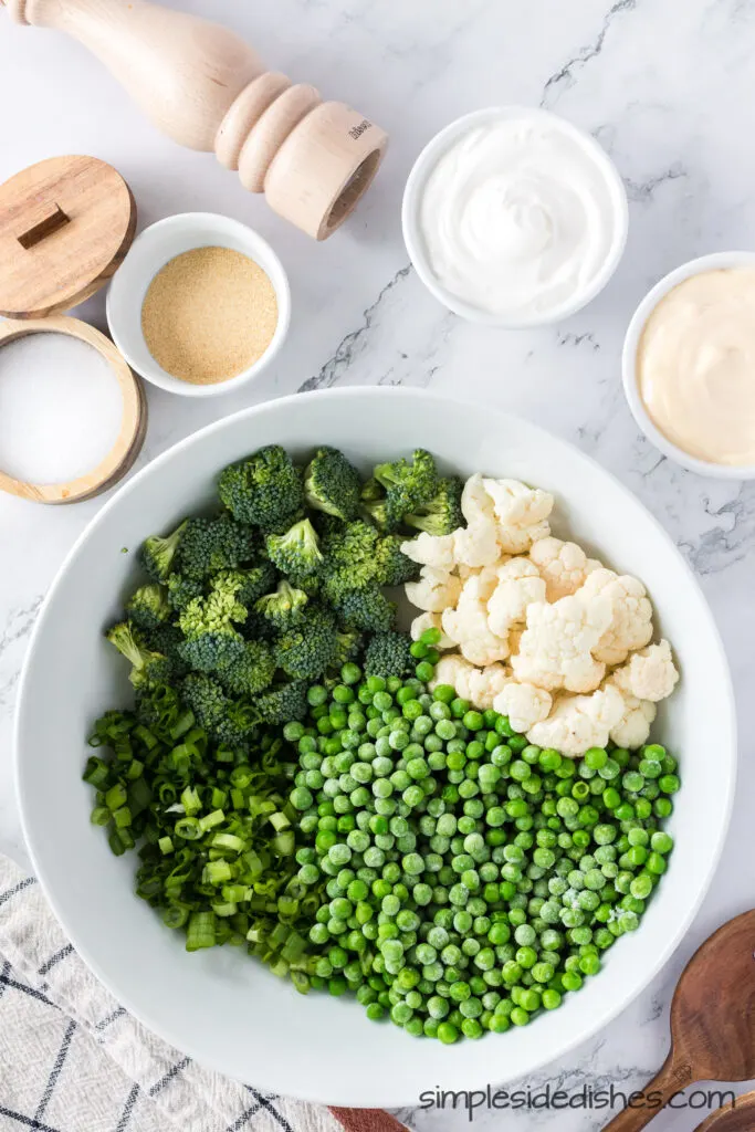 cauliflower, broccoli, frozen peas, and green onions