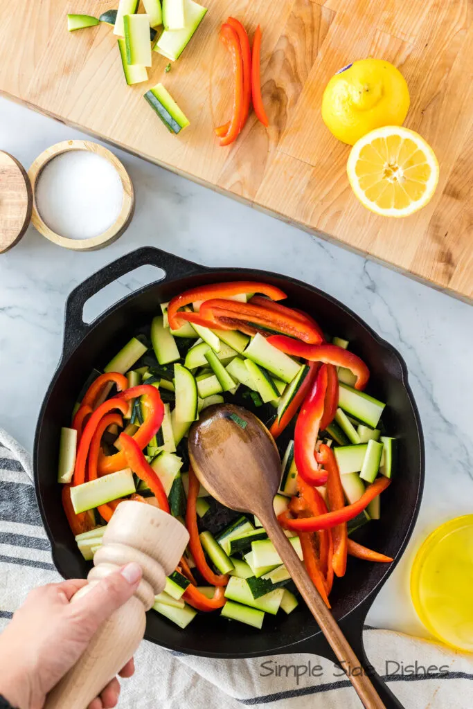 Zucchini and Bell Peppers added to skillet