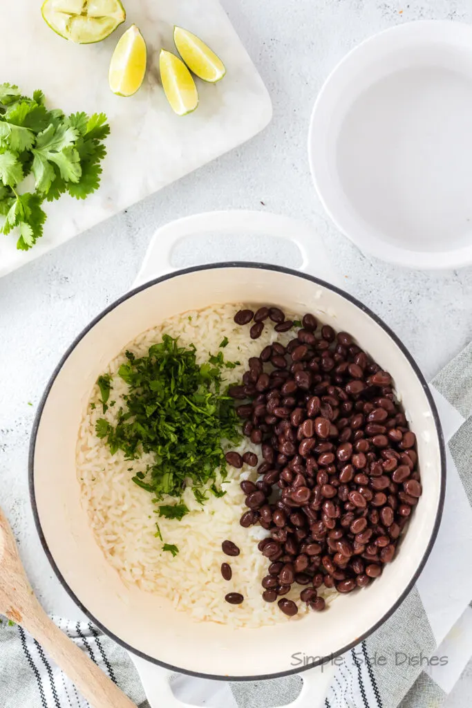 cooked rice, black beans, cilantro and lime juice all in a large pot
