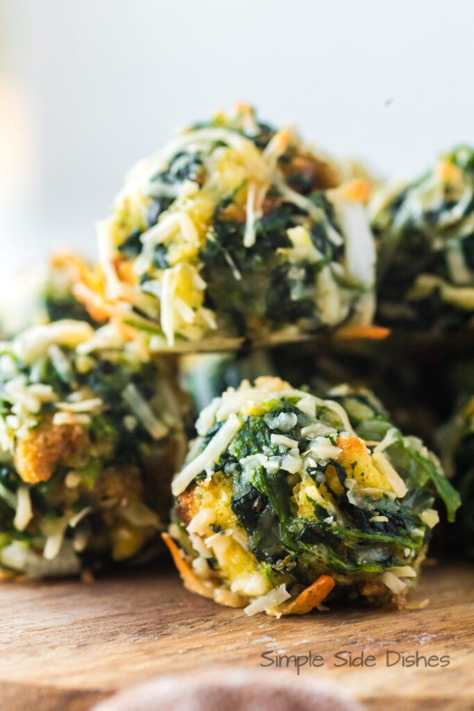 zoomed in image of spinach stuffing balls on platter stacked up