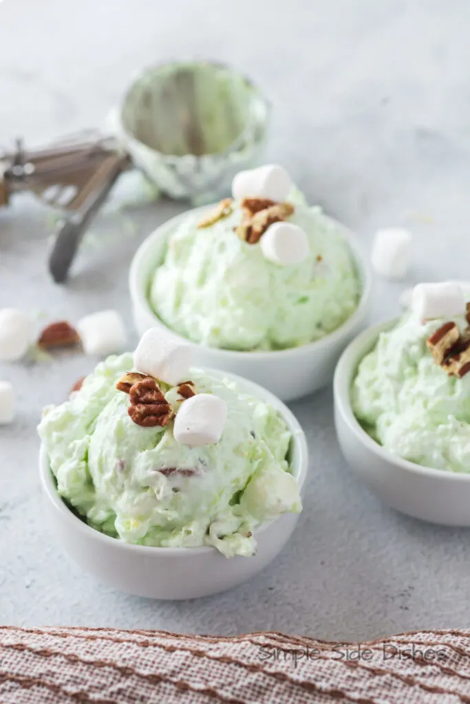 three bowls 3 bowls of watergate salad with pecans in bowls