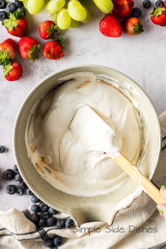 gently folding cool whip and vanilla into cream cheese mixture