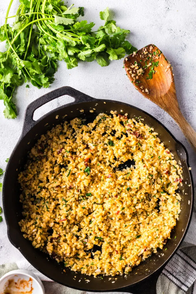Cooked cauliflower rice in skillet