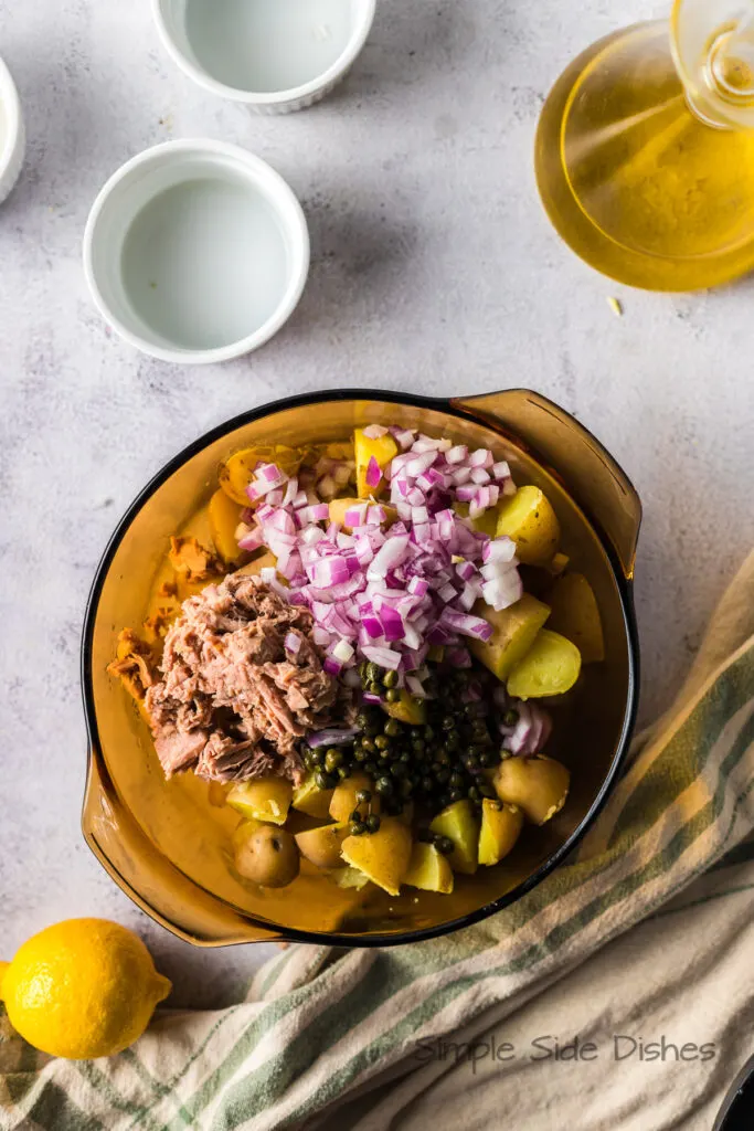 Tuna, Red onion and capers added to potatoes