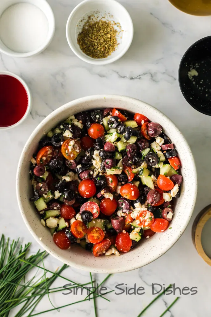 salad ingredients mixed up in a bowl.