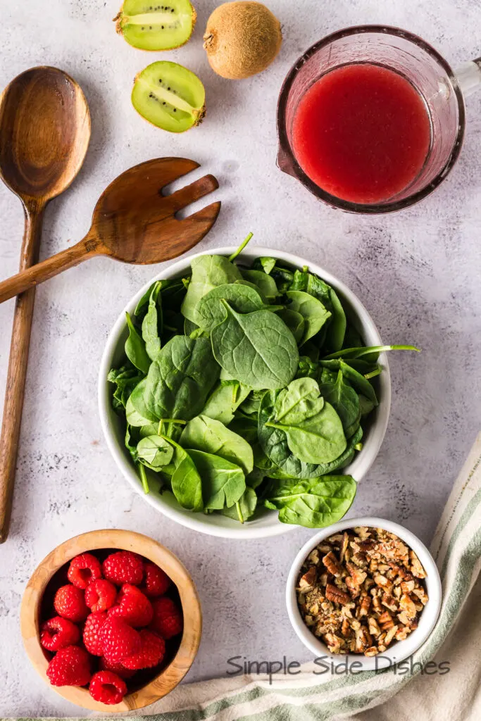 All ingredients laid out on counter for raspberry kiwi salad