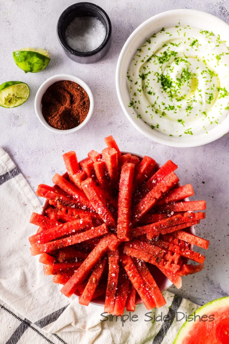 Seasoned watermelon sticks in a bowl.