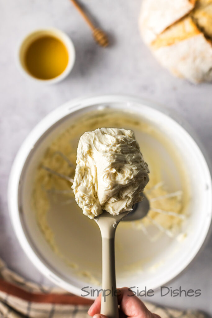 Whipped honey butter in mixer.