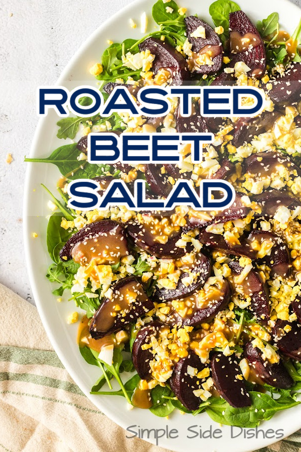 Main image for Roasted Beet Salad. Zoomed out image of salad on a bed of lettuce.