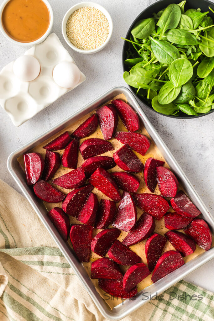 Beets laid out on the baking sheet ready to roast.